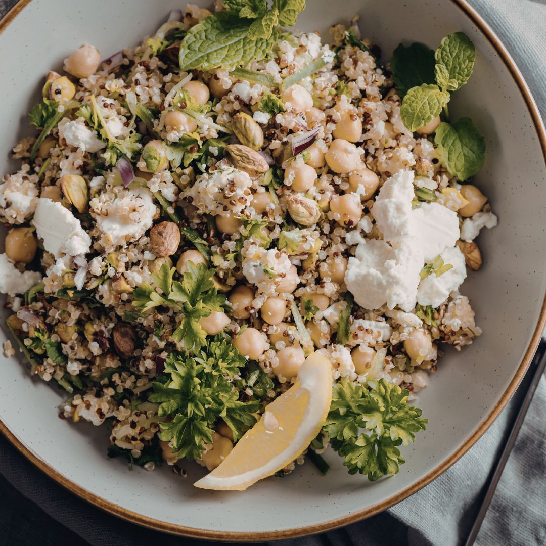 Fibre-rich spring salad with quinoa, chickpeas, asparagus, peas, leafy greens, seeds and feta, suitable for a PCOS-friendly gut health meal.